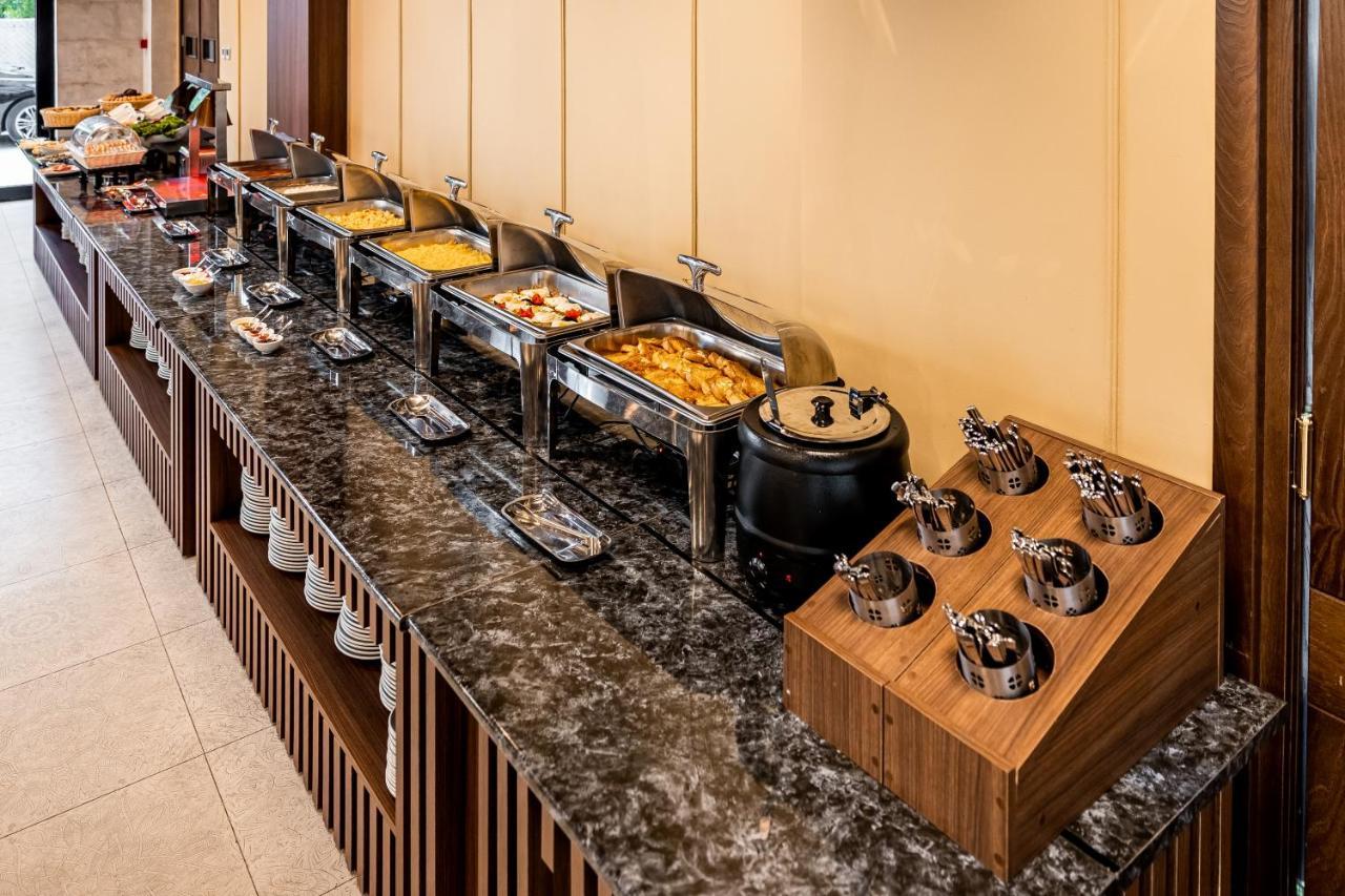 Kutaisi Inn Exterior photo A buffet at a hotel