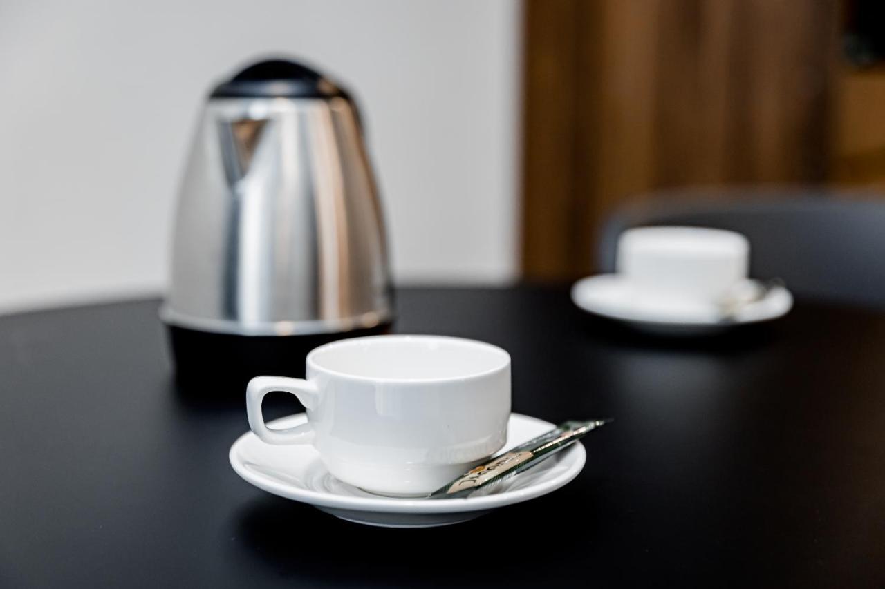 Kutaisi Inn Exterior photo A coffee cup and saucer